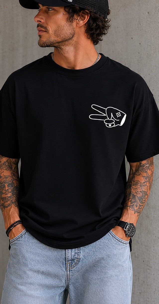 Front view of black Hustlin Hippie ‘BE ABOUT IT’ t-shirt with white peace hand logo on chest