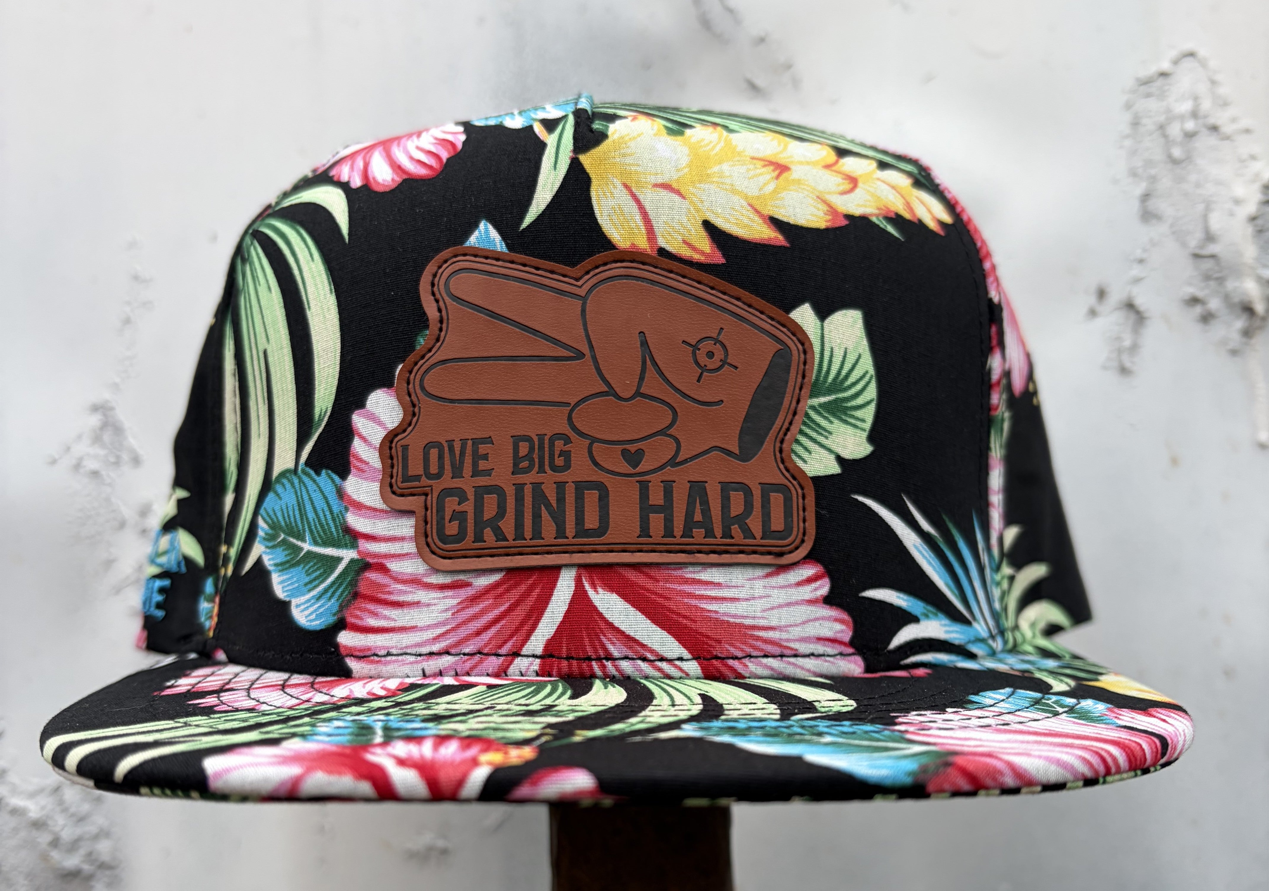 Floral flat bill snapback hat with tropical print and Love Big Grind Hard leather patch by Hustlin Hippie.