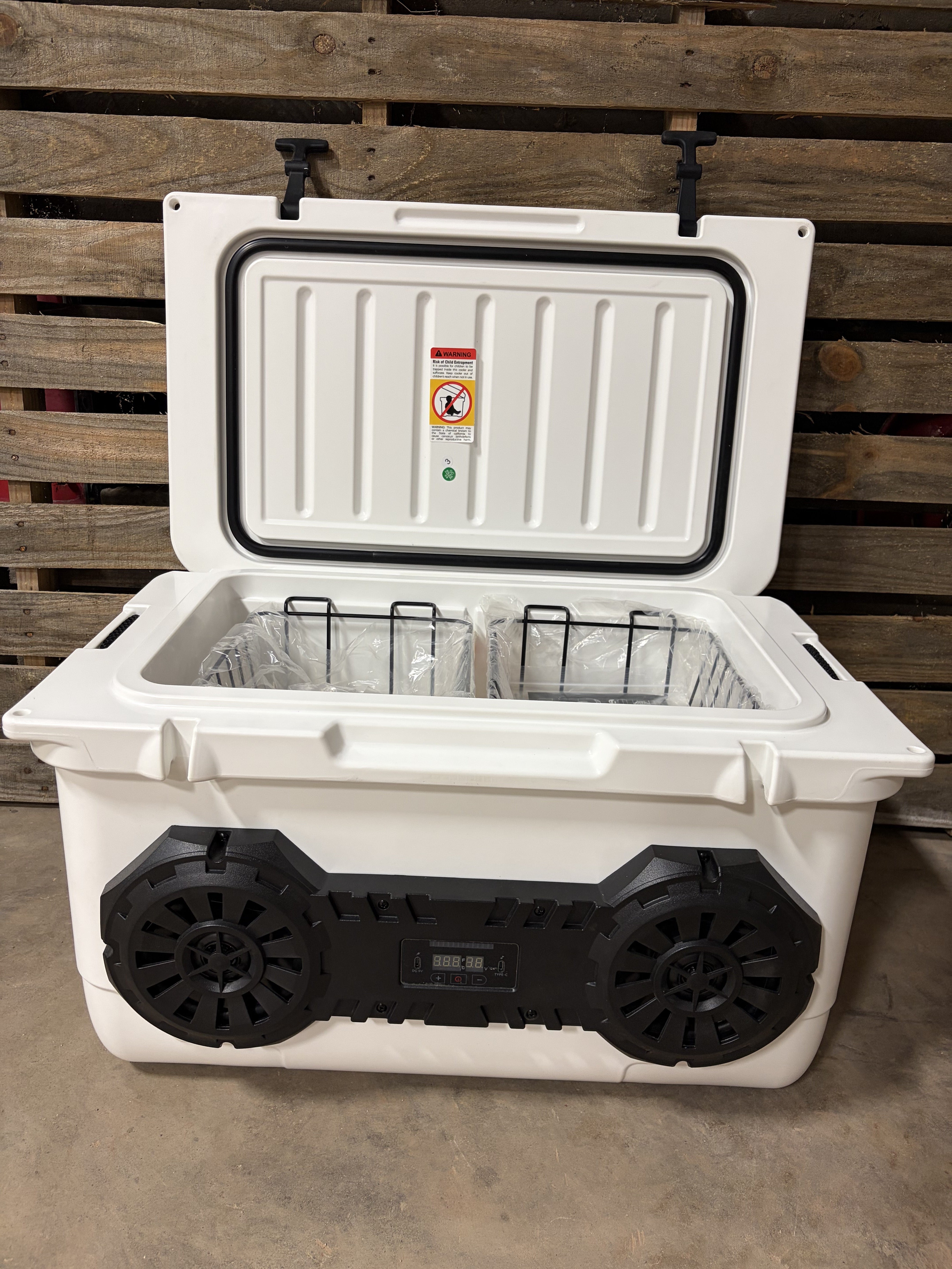 Open white dual-speaker Hound Boxx cooler with insulated lid, removable storage baskets and premium Bluetooth sound system