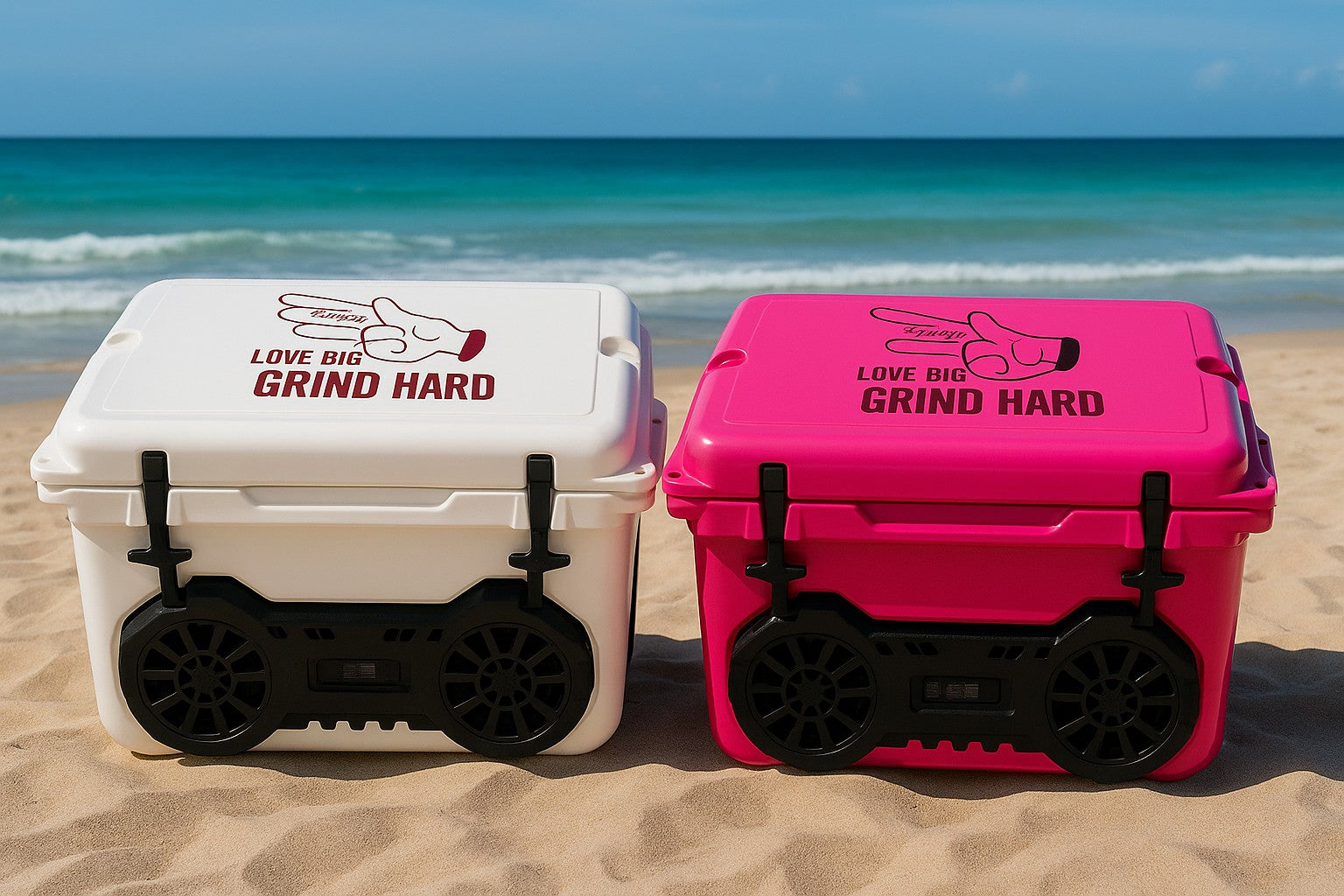 Two Hound Boxx coolers, one white and one pink, with 'Love Big Grind Hard' text on a beach.