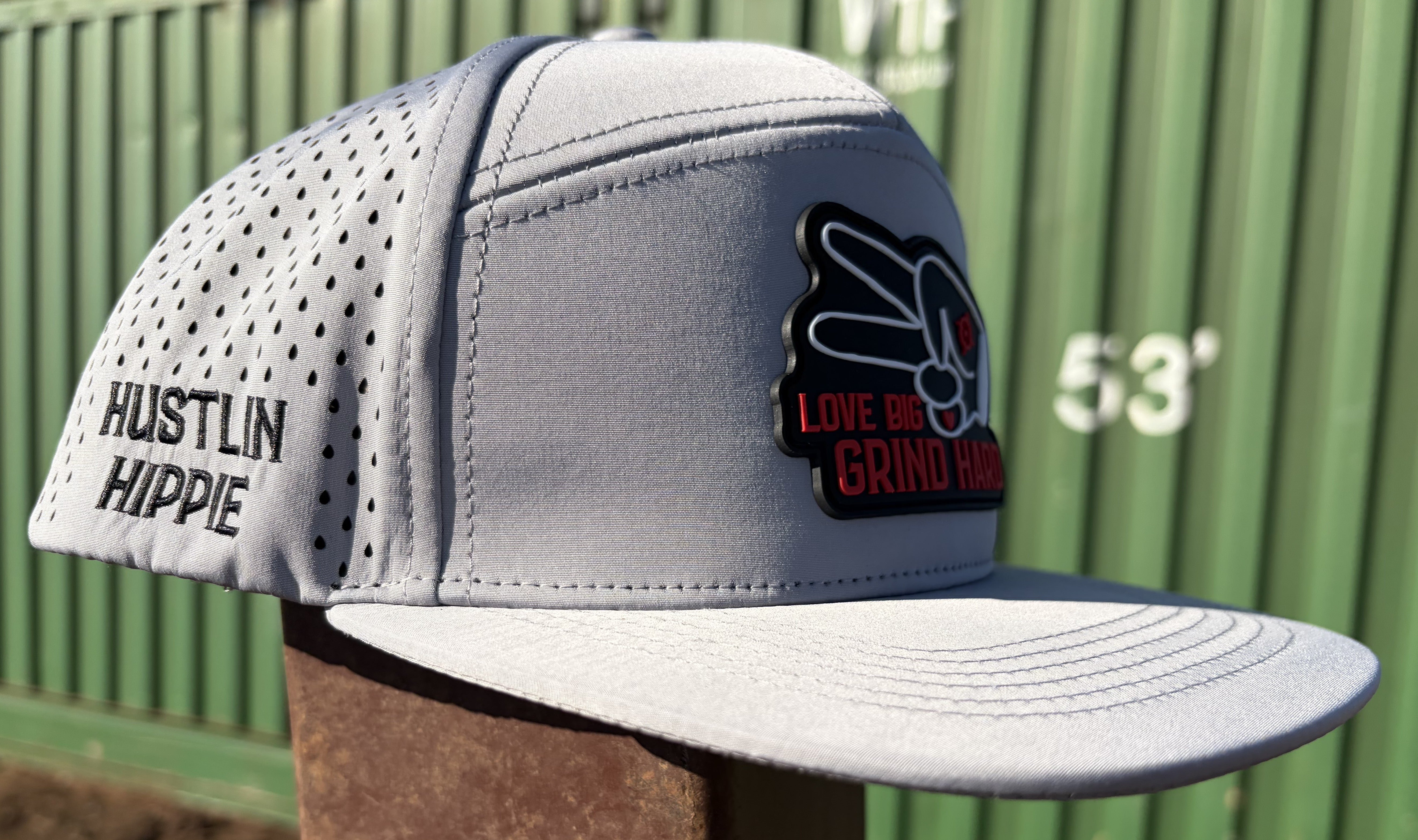 Gray 7 panel hydro snapback hat by Hustlin Hippie featuring breathable side panels and rubber front patch