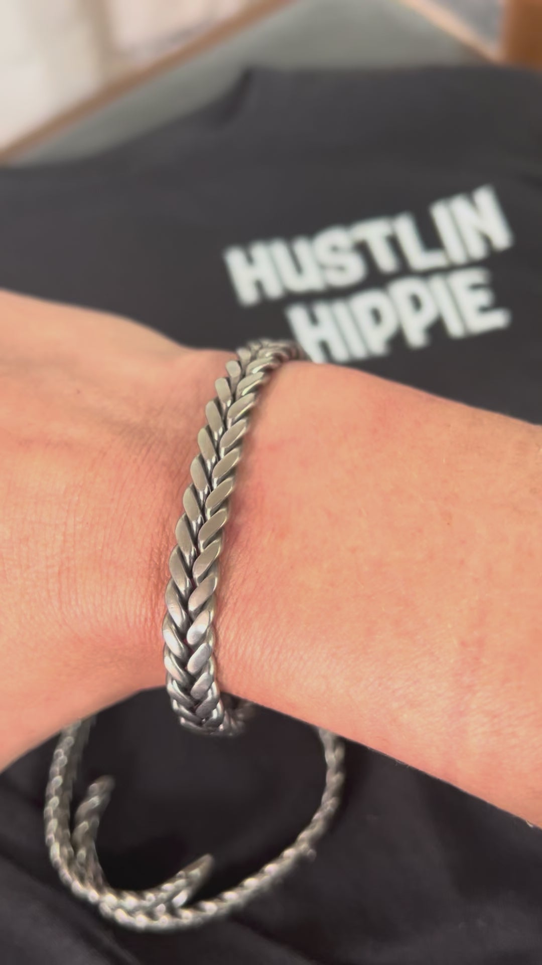 Video of unisex handmade stainless steel bracelet displayed on wrist.