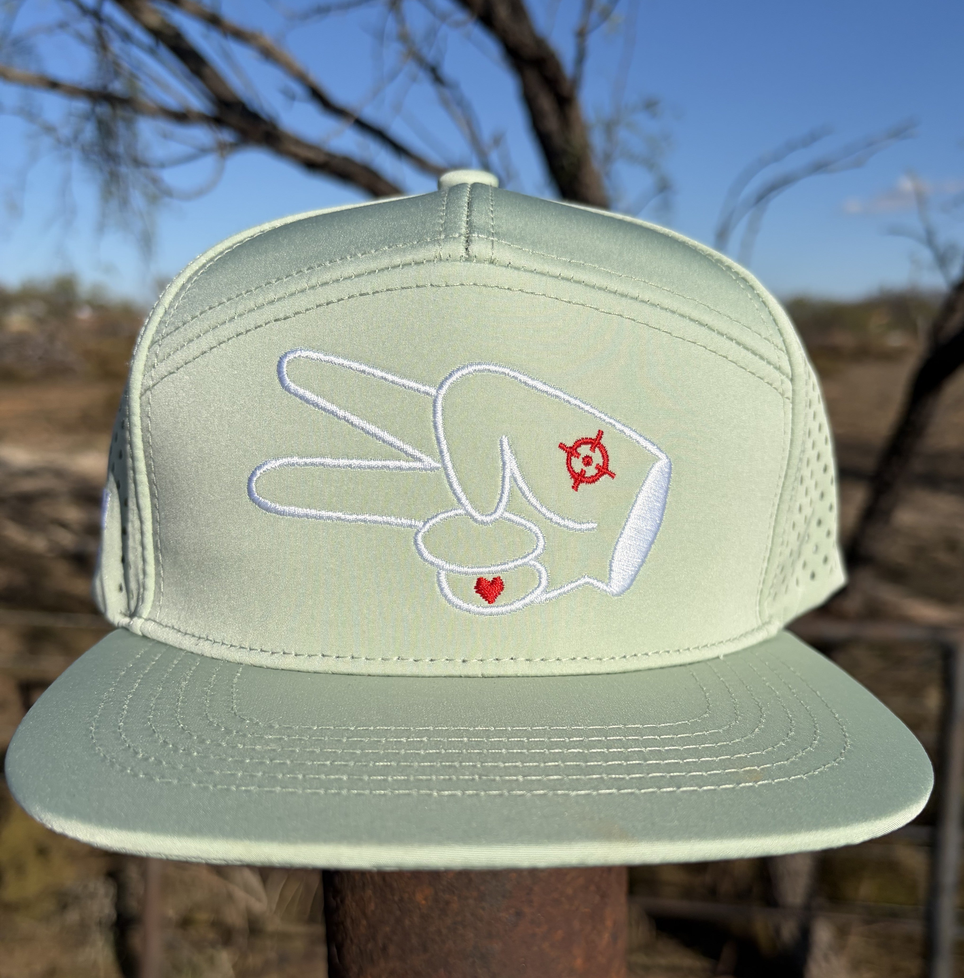 Centered front photo of the Signature Mint Green Hydro Snapback Hat styled outdoors with clean minimalist adventure vibes.